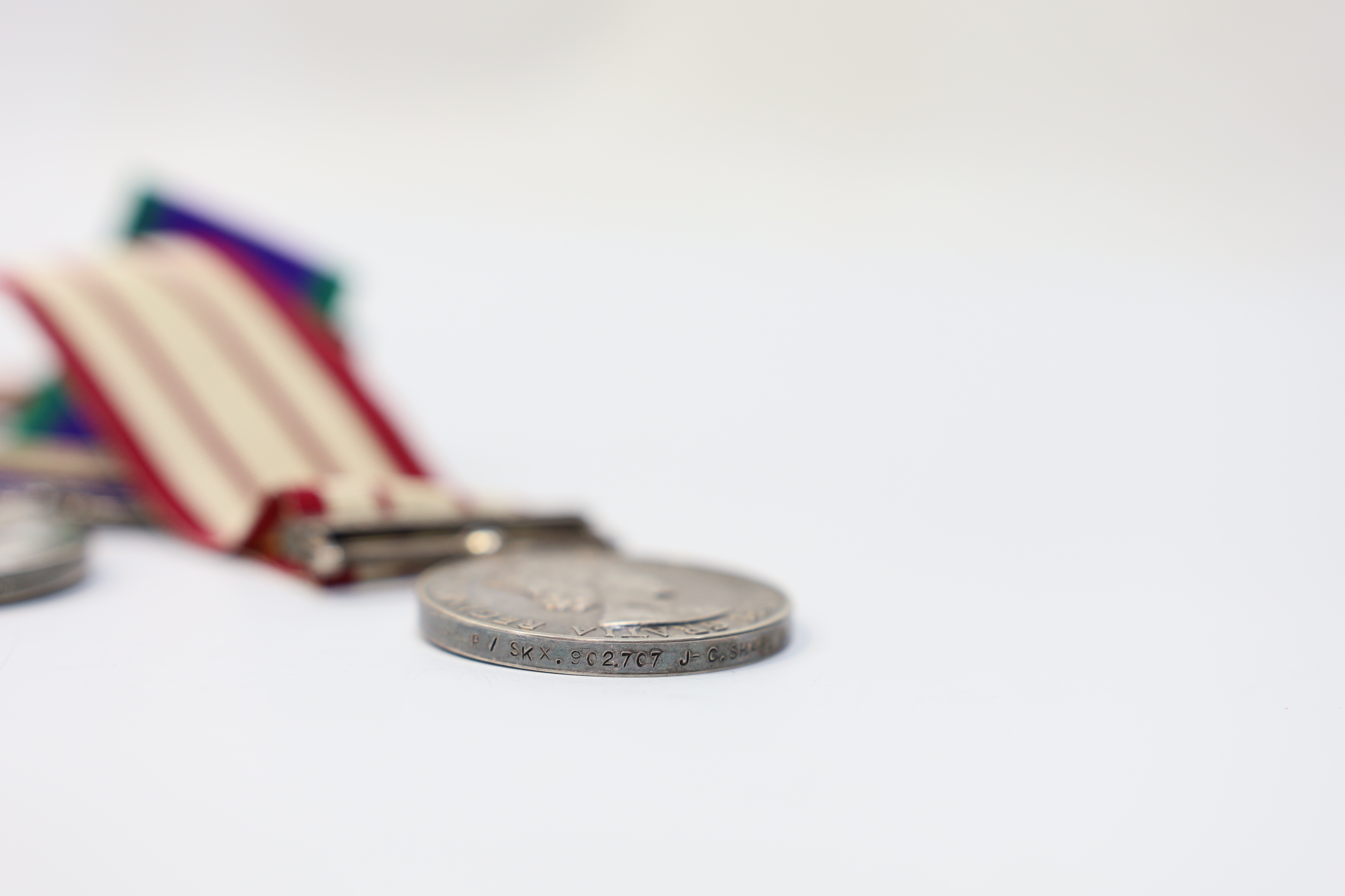 Three ERII Royal Navy medals; a Campaign Service Medal with a bar for Radfan awarded to J. Rush R.E.A.2 R.N., A Naval General Service Medal with a bar for the near East awarded to P/SKX J-C. Shaw M.(E.)1. R.N., plus a se